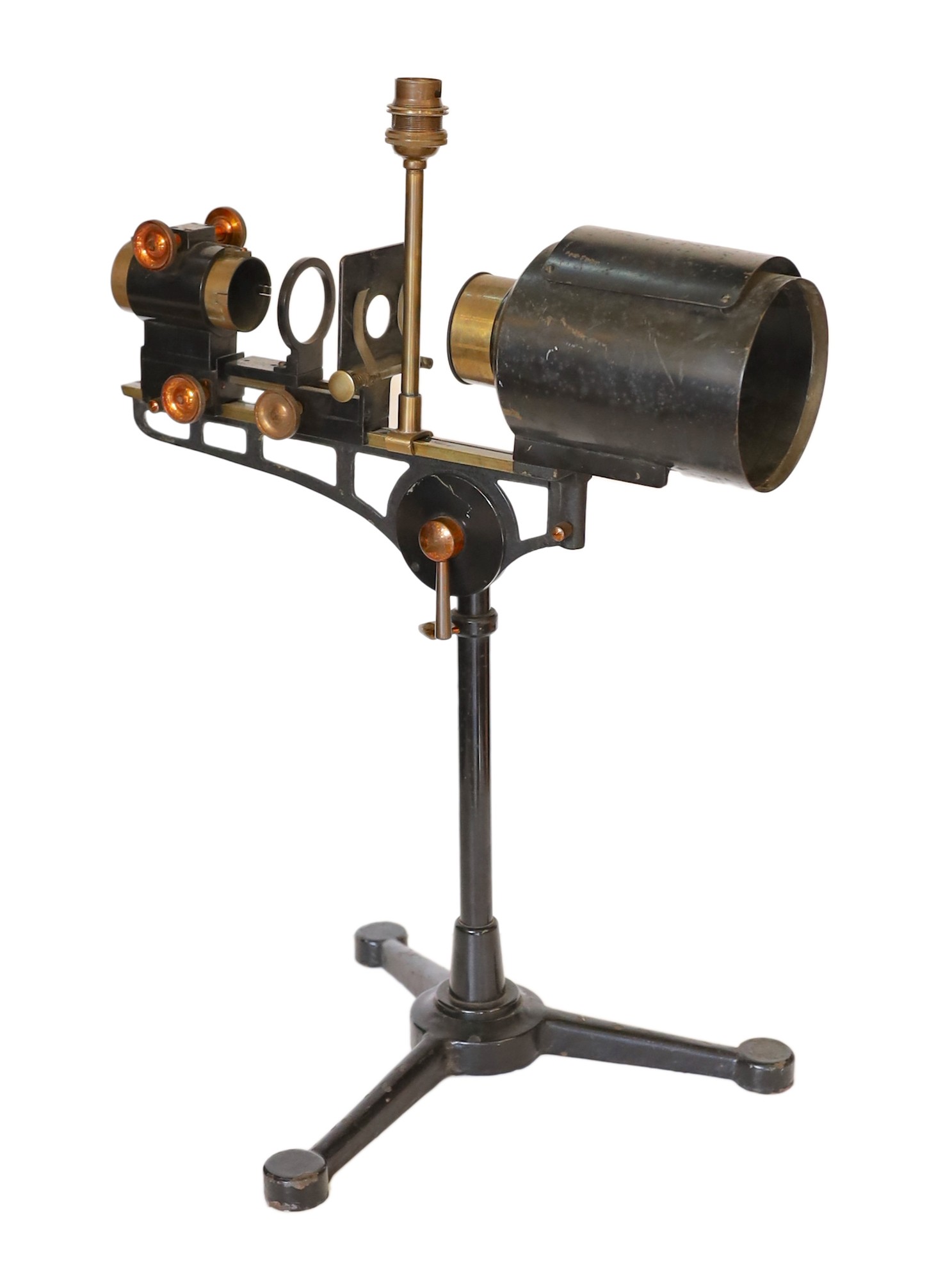 An early 20th century Hatters & Garnett Ltd black lacquered and brass microscope slide projector table lamp (conversion), height 57cm